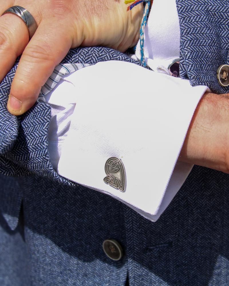 Cufflinks and wedding ring close-up